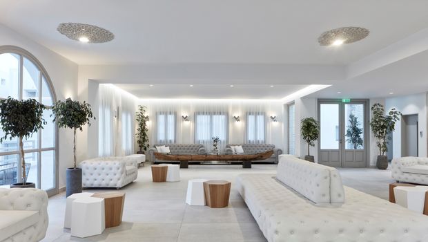 Elegante Hotel-Lobby im Costa Grand Resort & Spa – großzügiger, lichtdurchfluteter Raum mit modernen weißen Sitzmöbeln, stilvollen Deko-Elementen und mediterranen Pflanzen in minimalistischer, luxuriöser Atmosphäre.